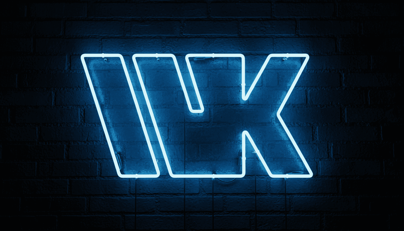 The WK mark in blue neon on a dark brick wall